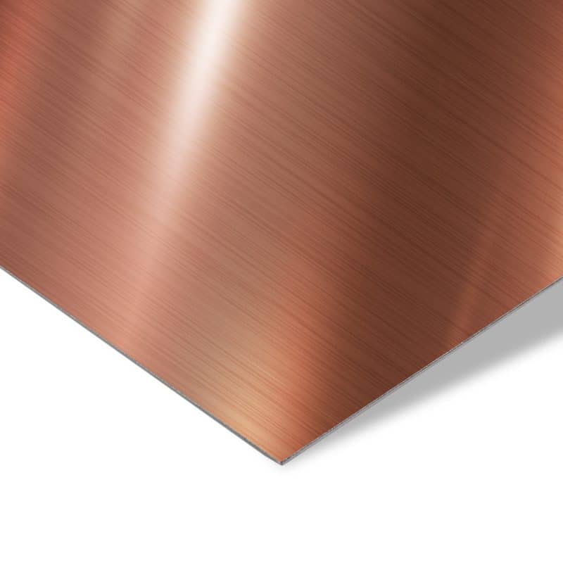 Gebürstetes Kupferblech in Nahaufnahme mit warmem metallischem Glanz.