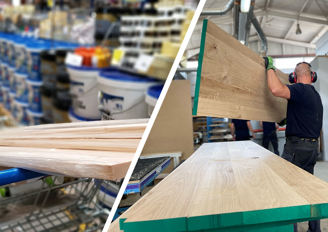 Eine Holzplatte wird von einem Handwerker in den Händen gehalten.